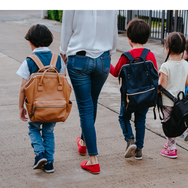Mom with 3 children who have backpacks